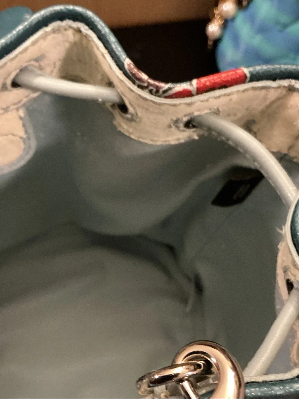 Coach Teal Floral Mini Drawstring Bucket Bag (rim has wear)